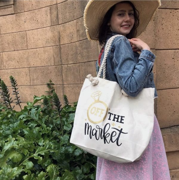 Young woman wearing an off the market tote bag