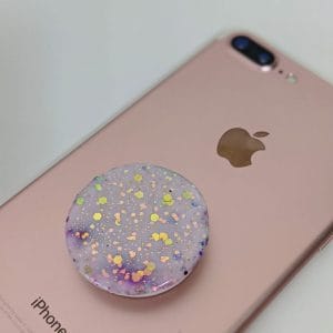 Speckled Opal phone grip placed on rose gold iphone